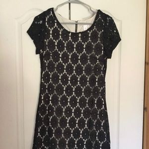 White sheath dress with black crochet overlay